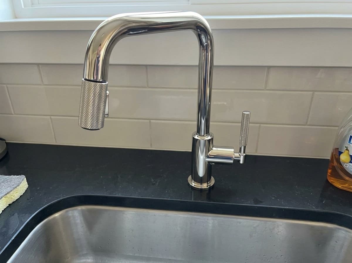 Brizo Litze pull-down kitchen faucet in polished nickel, shown installed (AI-generated image)